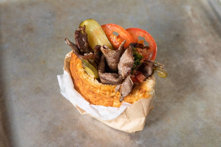 Miznon signature dishes Rib Eye Minute Steak
Lamb Kebab
The Original Whole Roasted Baby Cauliflower